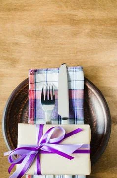 Festive Table Setting with Present. Stock Photos