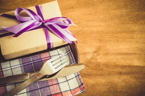 Festive Table Setting with Present. Stock Photos
