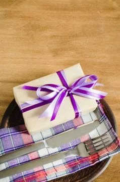 Festive Table Setting with Present. Stock Photos
