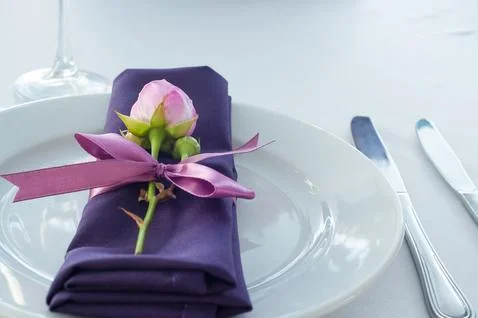 Festive table setting in the restaurant with flowers. Wedding decor. Stock Photos