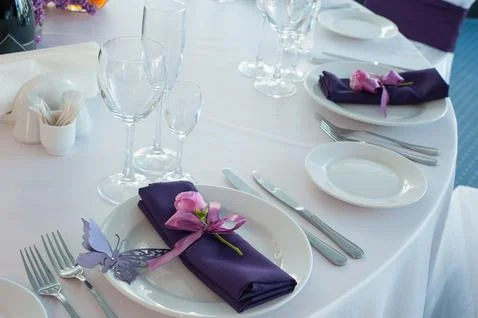 Festive table setting in the restaurant with flowers. Wedding decor. Stock Photos