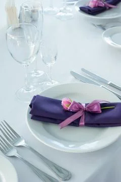 Festive table setting in the restaurant with flowers. Wedding decor. Stock Photos