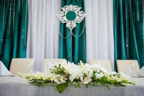 Festive table setting in the restaurant with flowers. Wedding decor. Stock Photos