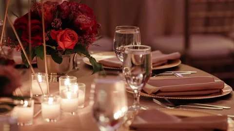 Festive table setting for a romantic candlelit dinner Stock Footage 227474035