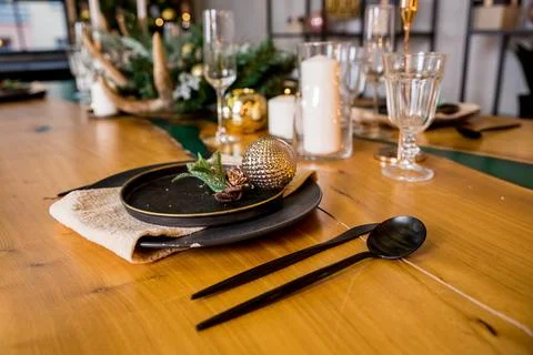 Festive table setting with rustic decorations for Christmas. New Year holidays Stock Photos