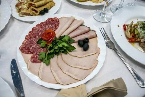 Festive table setting - salads, cold snacks, fruits Stock Photos