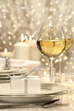 Festive table setting with silver ribbon gift Stock Photos