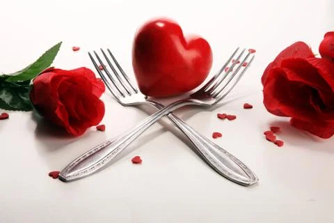 Festive table setting for Valentine's Day with forks and hearts Stock Photos