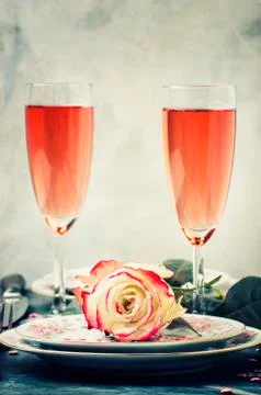 Festive table setting for valentines day, plates and glasses with pink champa Stock Photos