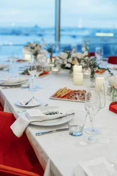 Festive table setting for a wedding or banquet with a panoramic view of the city Stock Photos