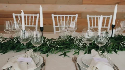On the festive table there are cutlery, glasses, plates Stock Footage 228467844