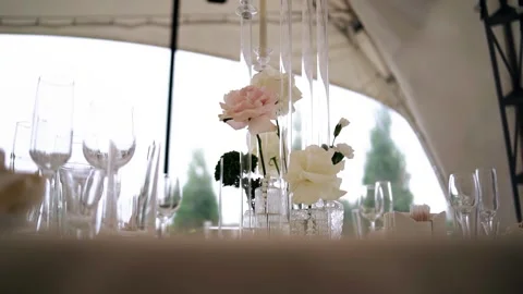 On the festive table, there is a vase with flowers and other decorations Stock-Footage 344898838
