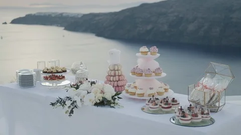 Festive table white cake panacota macaroons and flowers Stock Footage 115438407