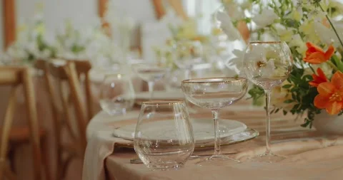 A festive table without food, decorated with beautiful dishes and flowers Stock Footage 306329778