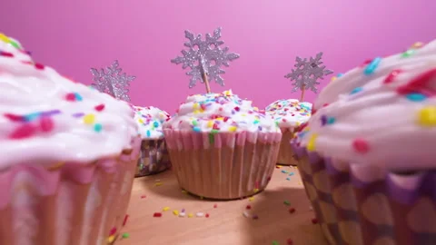 Festive Temptation: Up-Close View of Delicious Pastel Cupcakes for Christmas Stock Footage 255315010