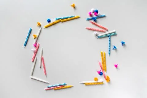 Festive text frame made of bright colorful birthday candles on white backgrou Stock Photos