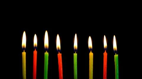 Festive thin colored candles Stock Photos
