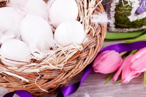 Festive traditional easter egg decoration ribbon and tulips Photos