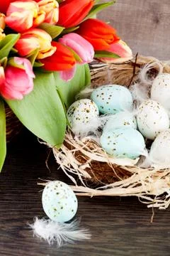 Festive traditional easter egg decoration ribbon and tulips Photos