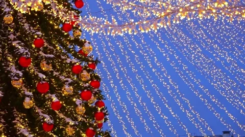 Festive tree, decorations and light strings against the twilight sky. Christm Stock Footage 219891250