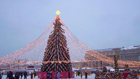 Festive tree, decorations and lights on the twilight city streets. Christmas Stock Footage 219891304