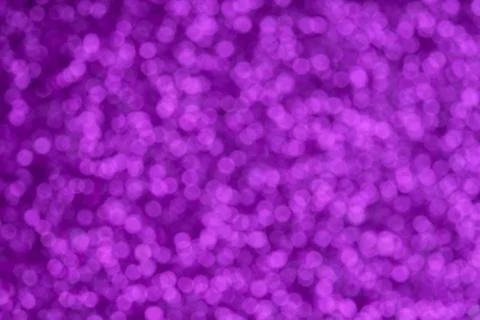 Festive violet pattern background. Holiday glowing party decoration. Magic il Stock Photos