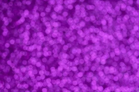 Festive violet pattern background. Holiday glowing party decoration. Magic Stock Photos