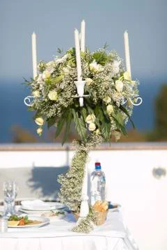 Festive wedding decorations. Candles on a server table Stock Photos