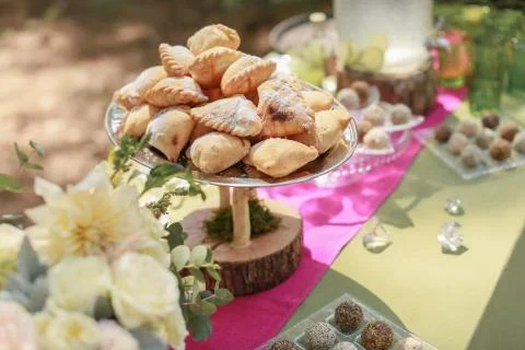 Festive wedding table, decorated with sweets and drinks Stock Photos