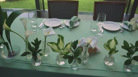 Festive, wedding table setting for two persons. Event. Plates, crystal glasses Stock Footage 312768244