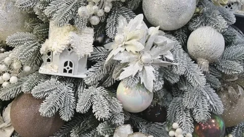 Festive winter holiday elements: frosted fir branches, sparkling silver Stock Footage 317082113