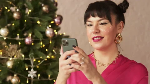 Festive woman typing message on mobile phone texting congratulations Stock Footage 166323490