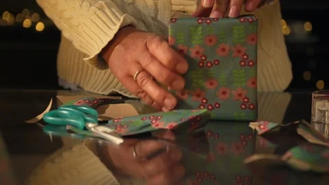 Festive Wrapping Materials with String and Decorative Illuminations Video stock 316962543
