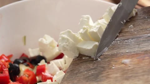 Feta Cheese adding into a Bowl with Salad. Stock Footage 256185690