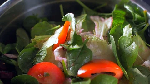 Feta cheese cubes fall on a fresh salad Video stock 108143634