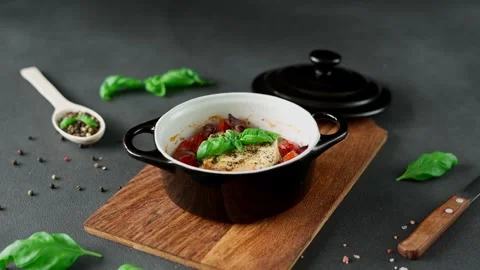 Feta cheese, Onions, cherry Tomatoes and Basil Baked in olive oil with spices Stock Footage 240944707