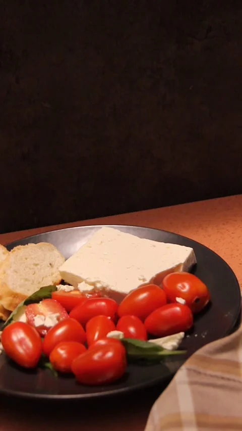 Feta cheese tomato bread platter vertical panning copy space Video stock 321760151