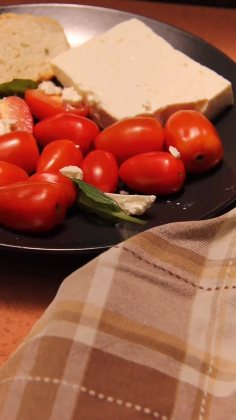 Feta cheese tomato bread platter vertical panning zoom in Stock Footage 321760187