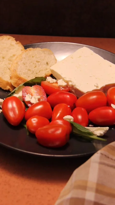 Feta cheese tomato bread platter vertical panning zoom out Stock Footage 321760208