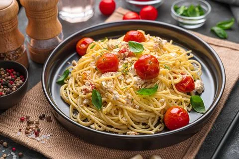Fetapasta with basil on a dark background. Stock Photos