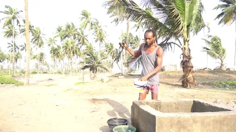 Fetching Water from a well Stock Footage 179710307