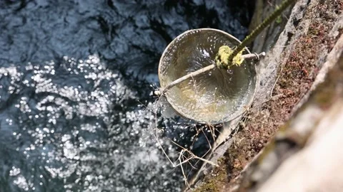 Fetching water from well by hand, fresh pure drinking mineral water Stock Footage 146252662