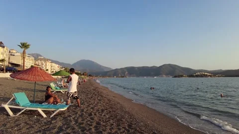Fethiye calis Beach beach with vacationing. Turkey Stock Footage 169546386