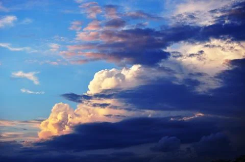 Feulette fluffy clouds in the expanse of the sky Stock Photos