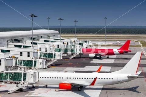 Few airliners parked at airport. Stock Photos
