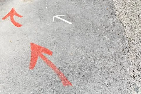 Few arrows - road pointers few arrows - road pointers on pavement Copyrigh... Stock Photos