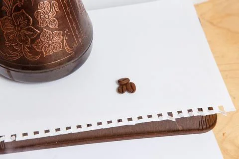 A few beans of coffee with a coffee maker Stock Photos