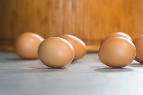 A few brown eggs on a table Stock Photos