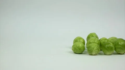 A few Brussels sprouts appear in the frame,rotating and running away.Stop motion Stock-Footage 84147224