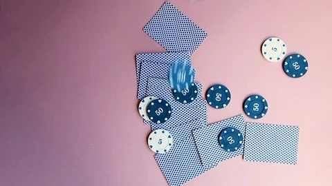 A few chips fall onto the table, where the cards and poker chips lie. Gambling f Stock Footage 119927662